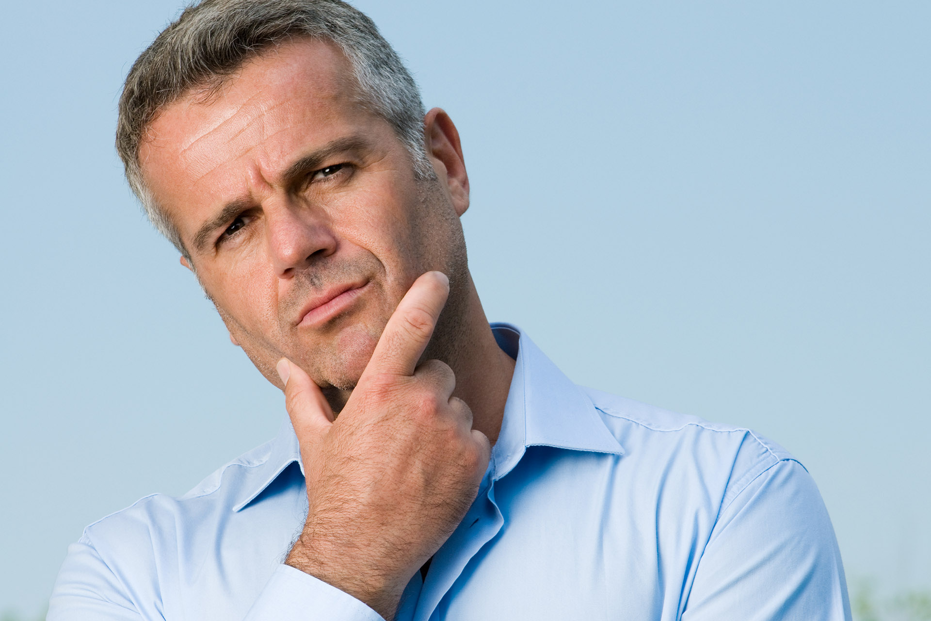 Man Posing With Contemplative and Doubtful Expression on His Face