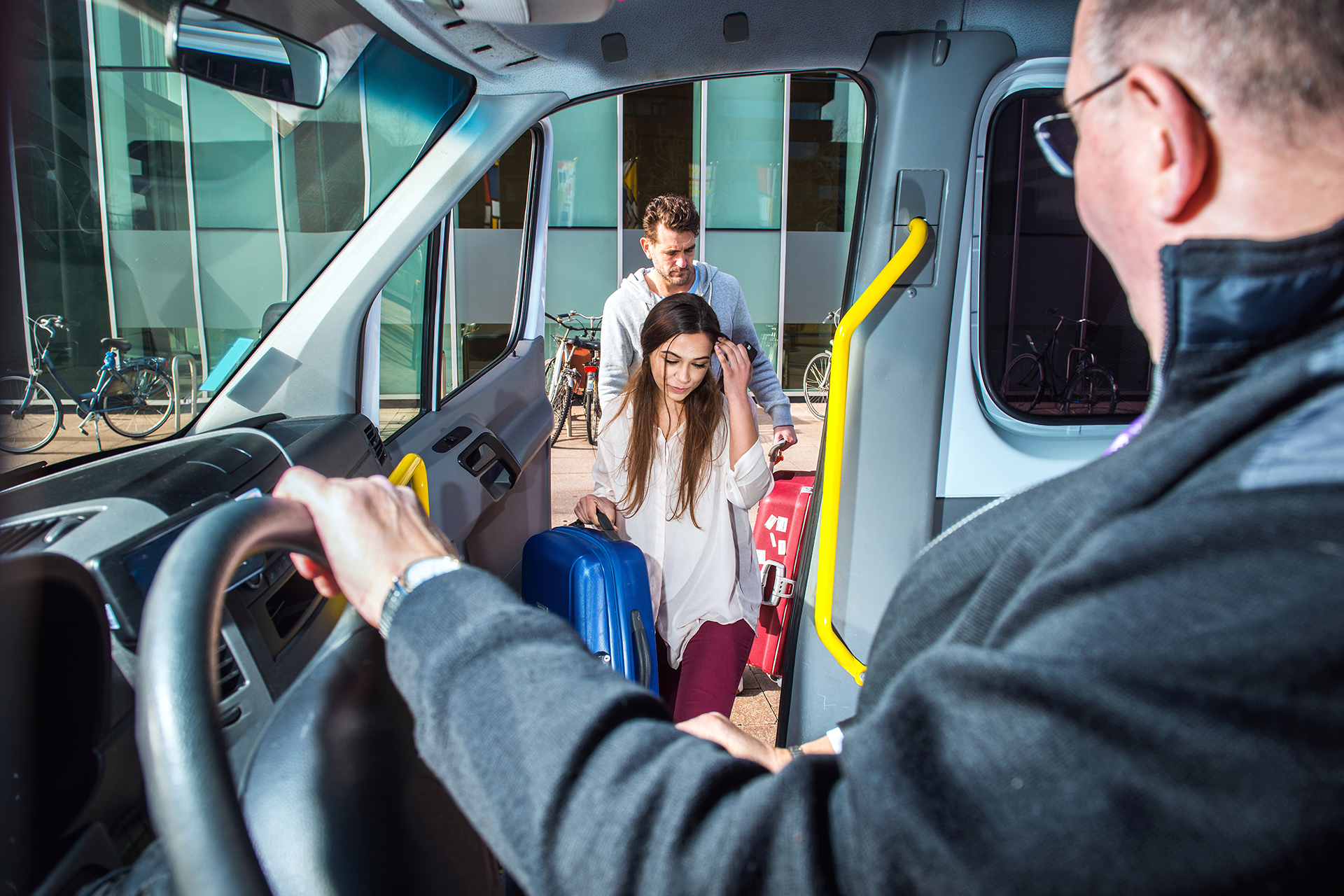 Van With Various People Getting Onboard